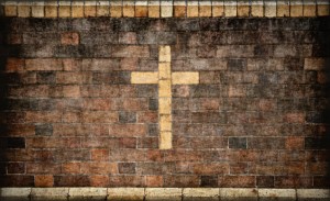 christian cross in brick wall